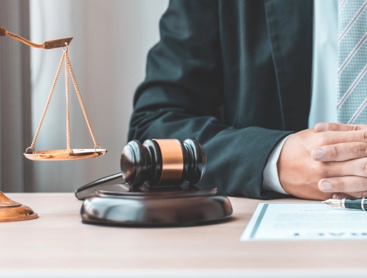 Man sitting at a desk with a Gavel